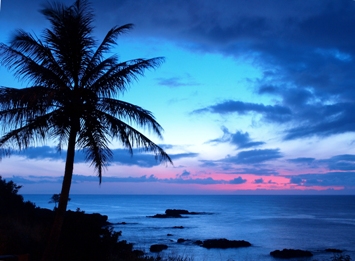 This photo of a sunset over Waimea Bay on the island of Oahu, Hawaii was taken by Gregory Runyan of Olathe, Kansas.